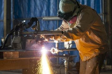 worker cutting steel