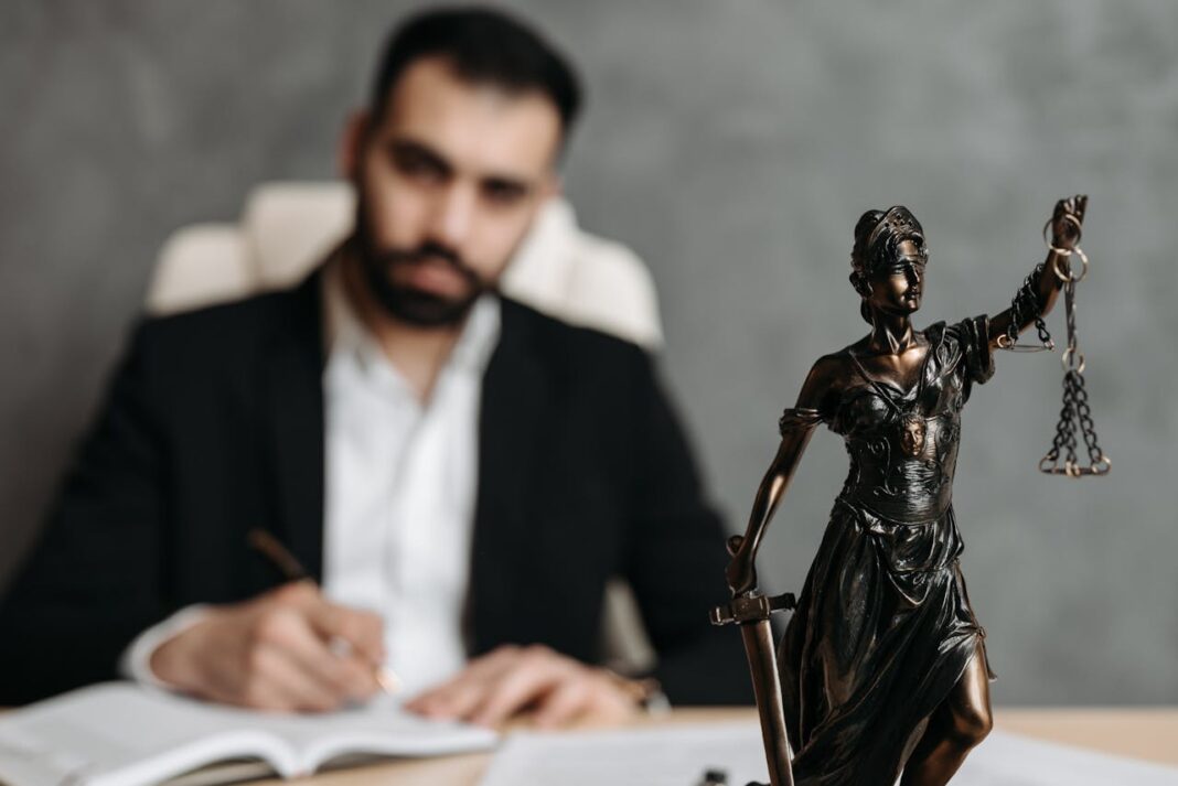 Photo by Pavel Danilyuk: https://www.pexels.com/photo/man-in-black-suit-jacket-sitting-on-chair-8112107/