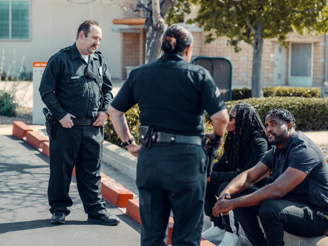 Photo by Kindel Media: https://www.pexels.com/photo/police-officers-talking-to-civilians-7714863/