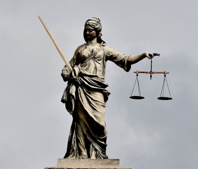 https://unsplash.com/photos/a-statue-of-lady-justice-holding-a-sword-and-a-scale-gYbOFTwcJx4