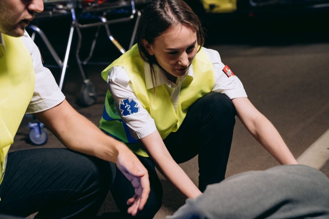 Photo by Mikhail Nilov: https://www.pexels.com/photo/paramedics-helping-the-casualty-lying-on-the-ground-8942736/