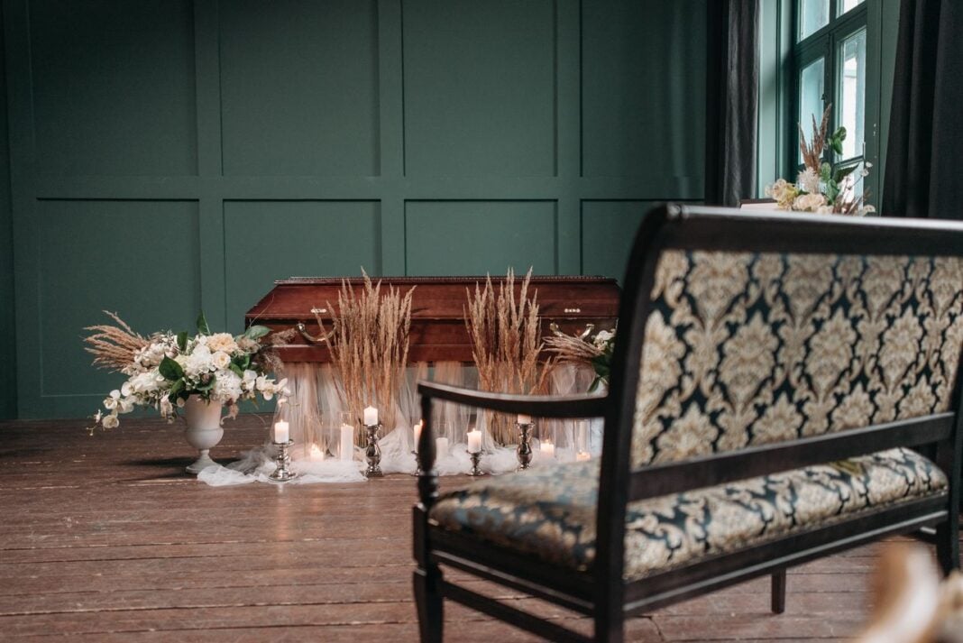 Photo by Pavel Danilyuk: https://www.pexels.com/photo/dried-flowers-and-lighted-candles-near-a-brown-wooden-coffin-7317675/