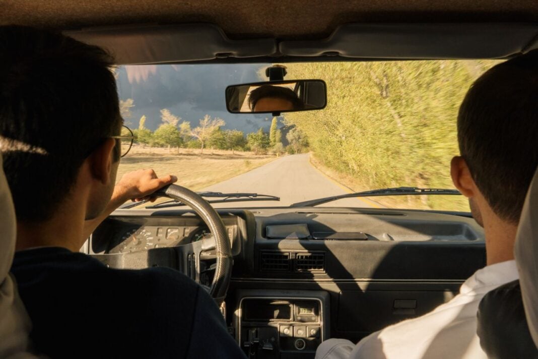 Photo by Orhan Pergel: https://www.pexels.com/photo/two-men-driving-in-a-car-on-a-road-28336659/