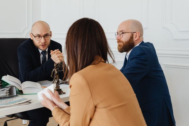 a-lawyer-talking-to-the-woman-wearing-brown-blazer
